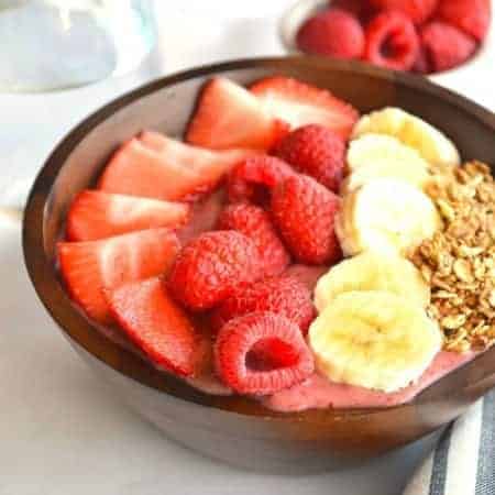 Banana Berry Acai Bowl. Filling, healthy, sweet, fruity breakfast bowl made with Acai, banana, strawberries and raspberries.
