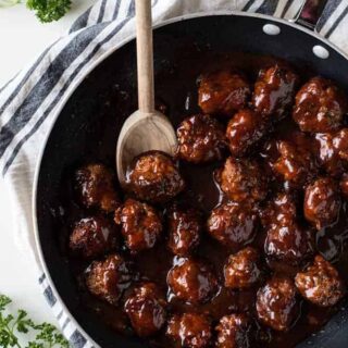 Bacon Bourbon Meatballs! These meatballs are made with bacon and ground beef and simmered in a bourbon bbq sauce. Perfect to serve as an appetizer for the big game or on a sandwich for family dinner!