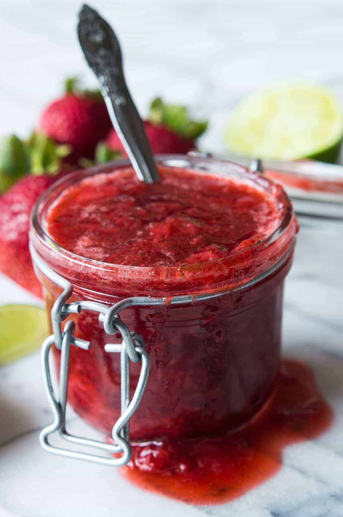 This Strawberry Margarita Dessert Sauce is the perfect topping for your ice cream, cakes, cookies, cheesecakes. Super easy to make, you will be using this on everything! 