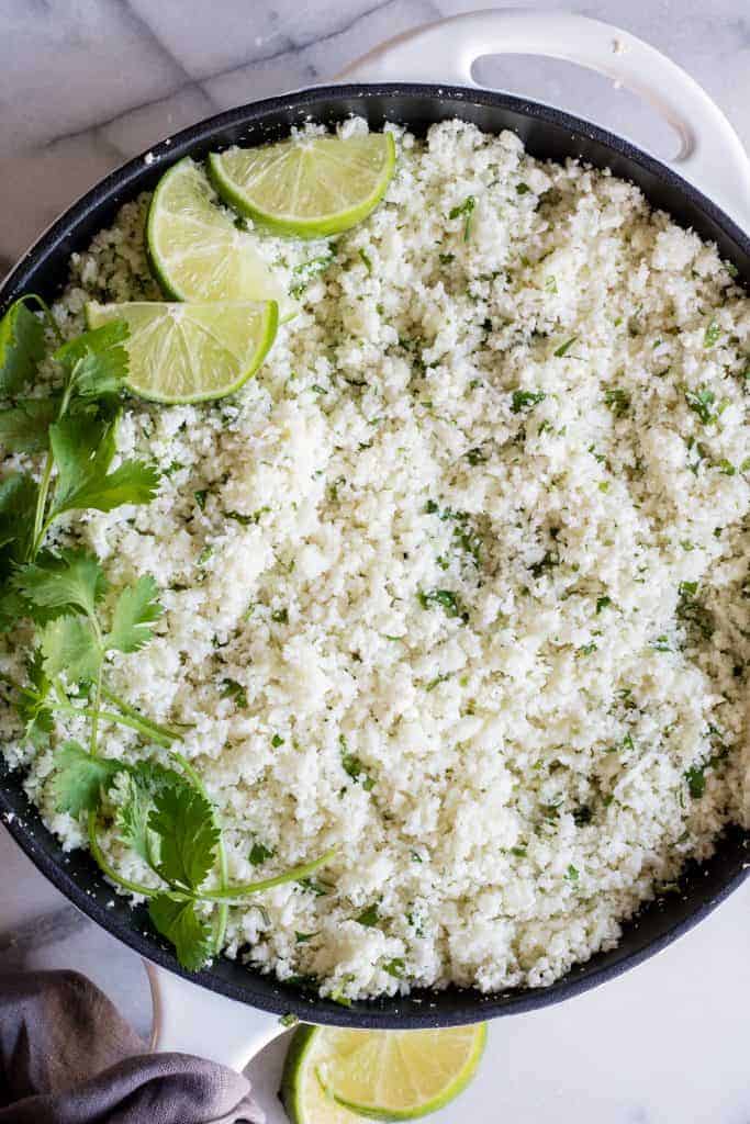 Overhead shot of cilantro lime cauliflower rice in a skillet.