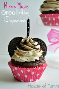These chocolate cupcakes are topped with an Oreo Birthday Cake frosting and decorated to resemble Minnie Mouse!  Perfect addition to any little girl's birthday party