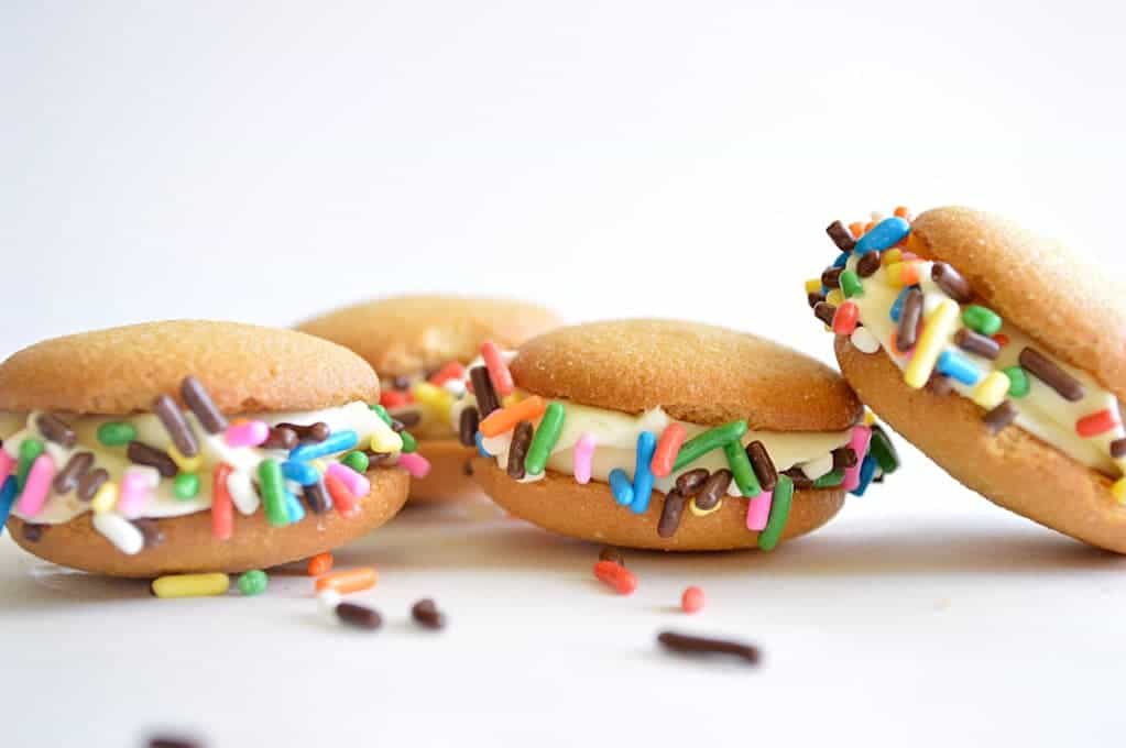 Banana pudding cookies with sprinkles on the sides. 