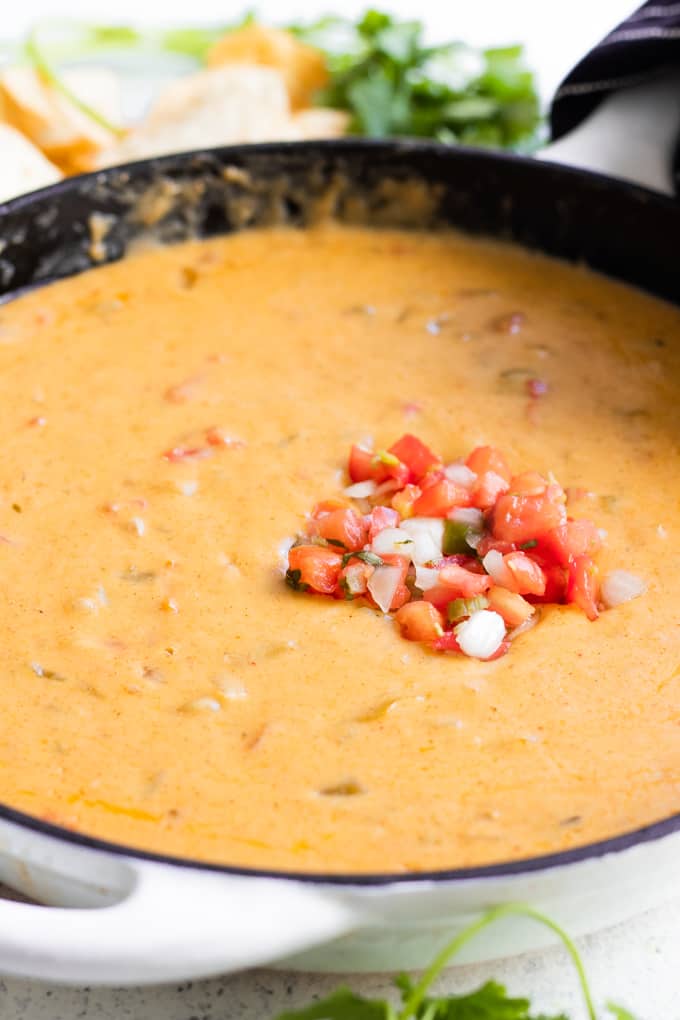 A skillet filled with homemade queso. 