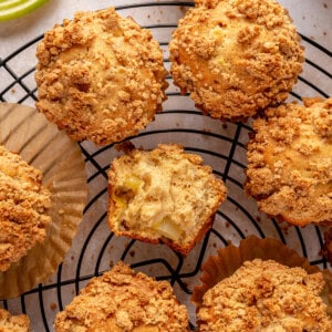 Apple Crumb Muffins on a wire rack.