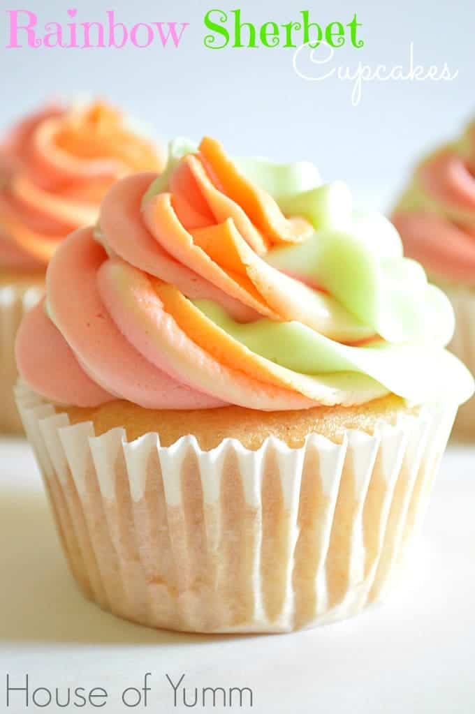 These Rainbow Sherbet Cupcakes are made with real rainbow sherbet in the cake batter and topped with three flavors of swirled frosting! #houseofyumm