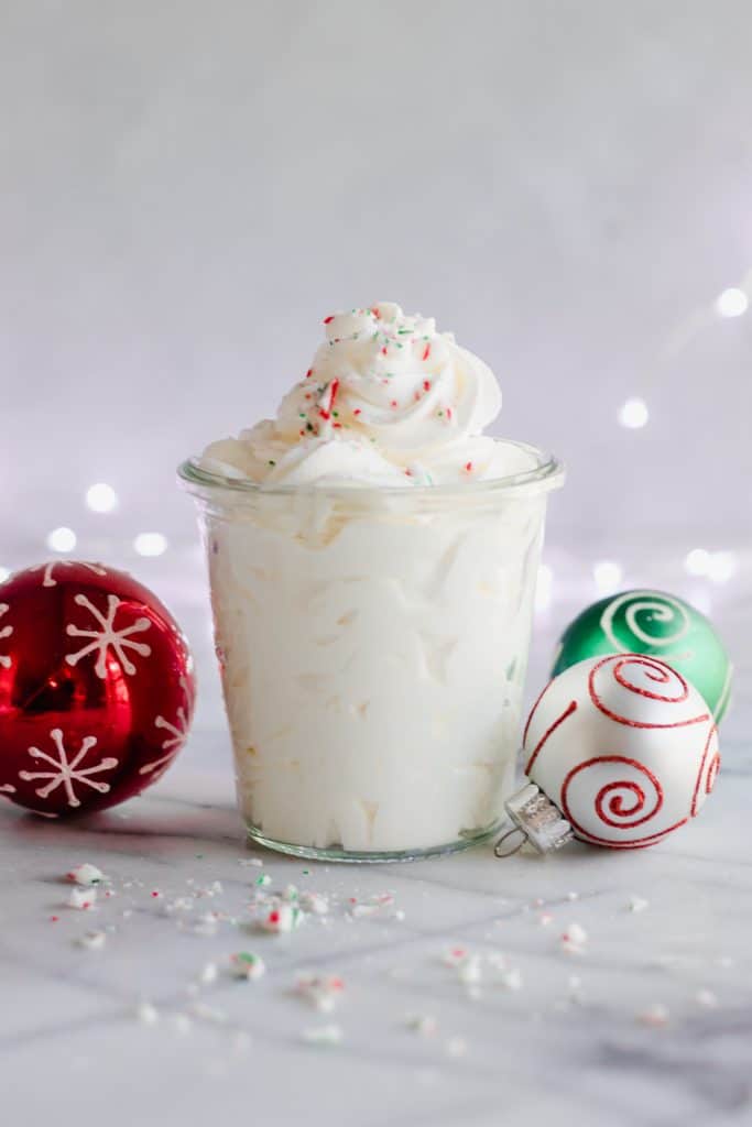 Peppermint Whipped Cream, only three ingredients, super easy, and delightfully minty!  Perfect on top of any hot drink, or just to eat with a spoon.  