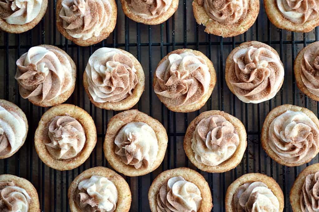 Soft and fluffy Snickerdoodle Cookie cups filled with sweet cinnamon and vanilla swirled frosting. 