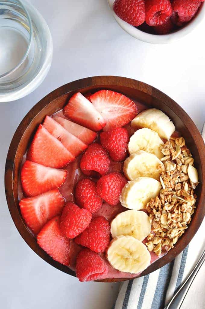 Banana Berry Acai Bowl.  Filling, healthy, sweet, fruity breakfast bowl made with Acai, banana, strawberries and raspberries.