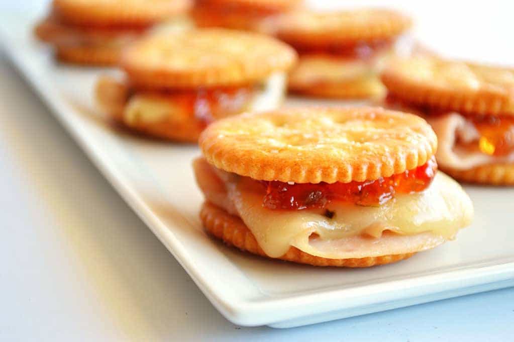 Spicy Turkey Ritz Sandwiches.  Turkey, pepperjack, pepper jelly all loaded on a Ritz cracker for a fun appetizer.