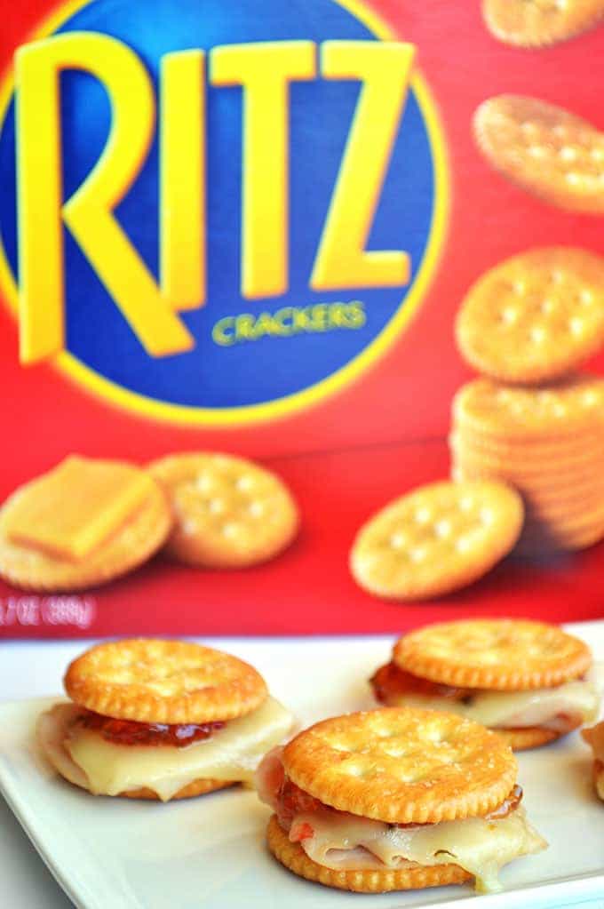 Spicy Turkey Ritz Sandwiches.  Turkey, pepperjack, pepper jelly all loaded on a Ritz cracker for a fun appetizer.