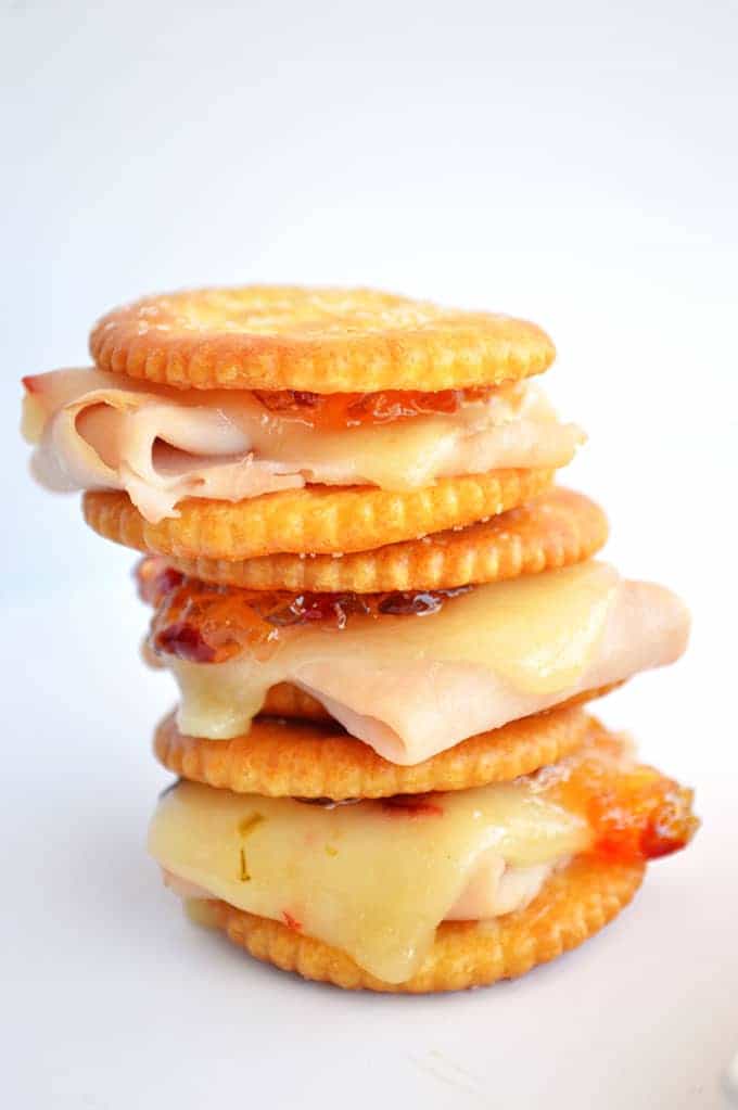 Spicy Turkey Ritz Sandwiches.  Turkey, pepperjack, pepper jelly all loaded on a Ritz cracker for a fun appetizer.