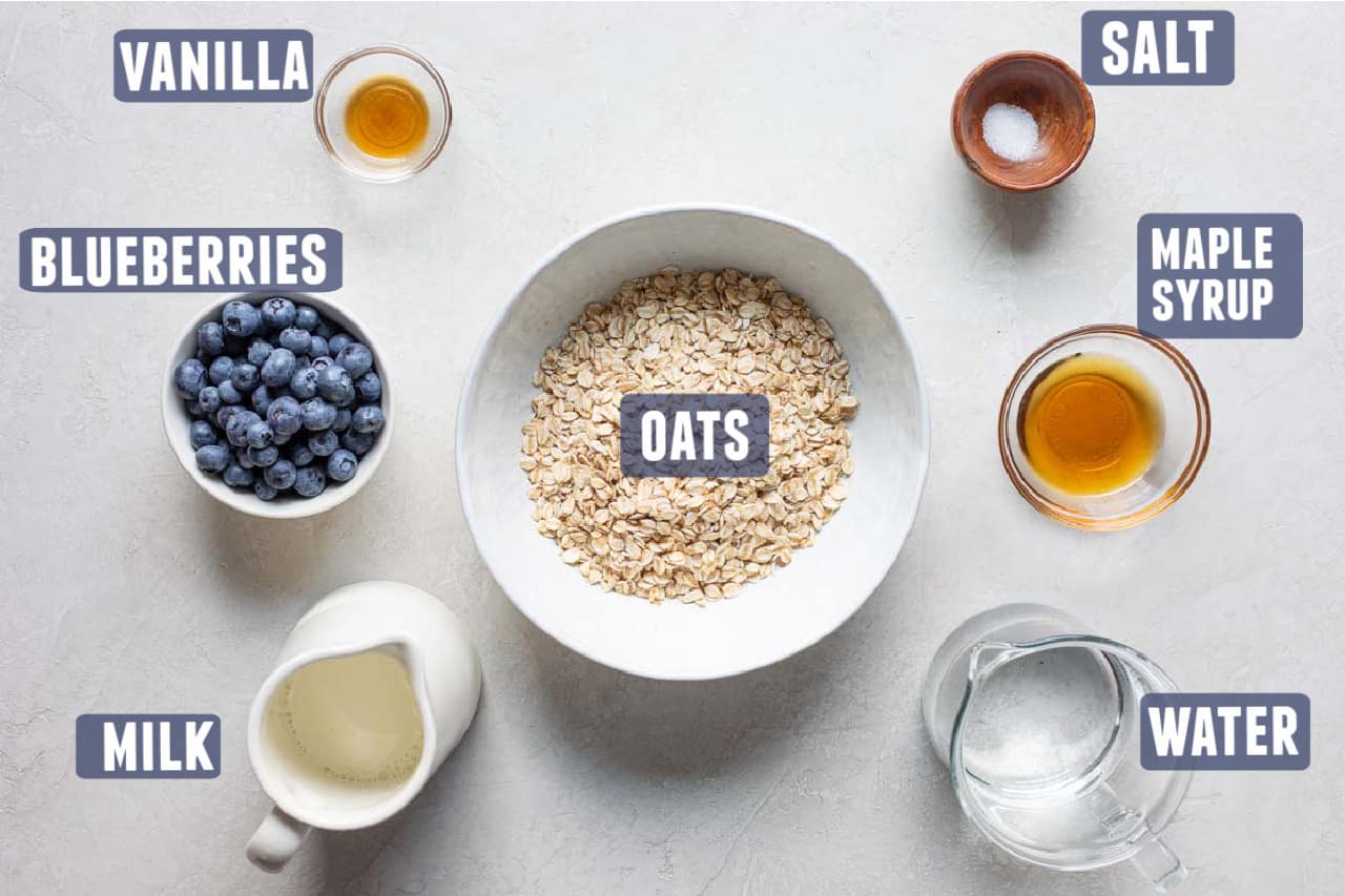 Ingredients needed to make Blueberry Oatmeal laid out on the counter.