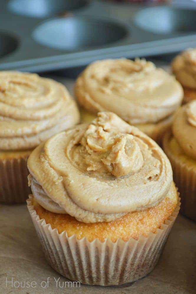 Cupcakes with peanut butter frosting filled with peanut butter and jelly