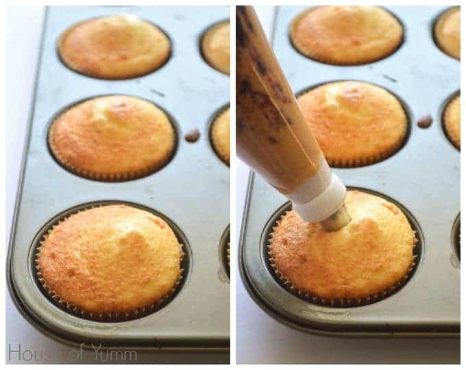 White cupcakes being stuffed with a mixture of peanut butter and jelly using a piping bag