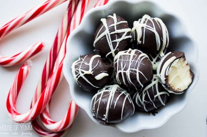 EASY 4 Ingredient Peppermint Truffles. Dreamy melt in your mouth creamy peppermint white chocolate ganache center. Dipped and drizzled with chocolate. Perfect Christmas dessert!