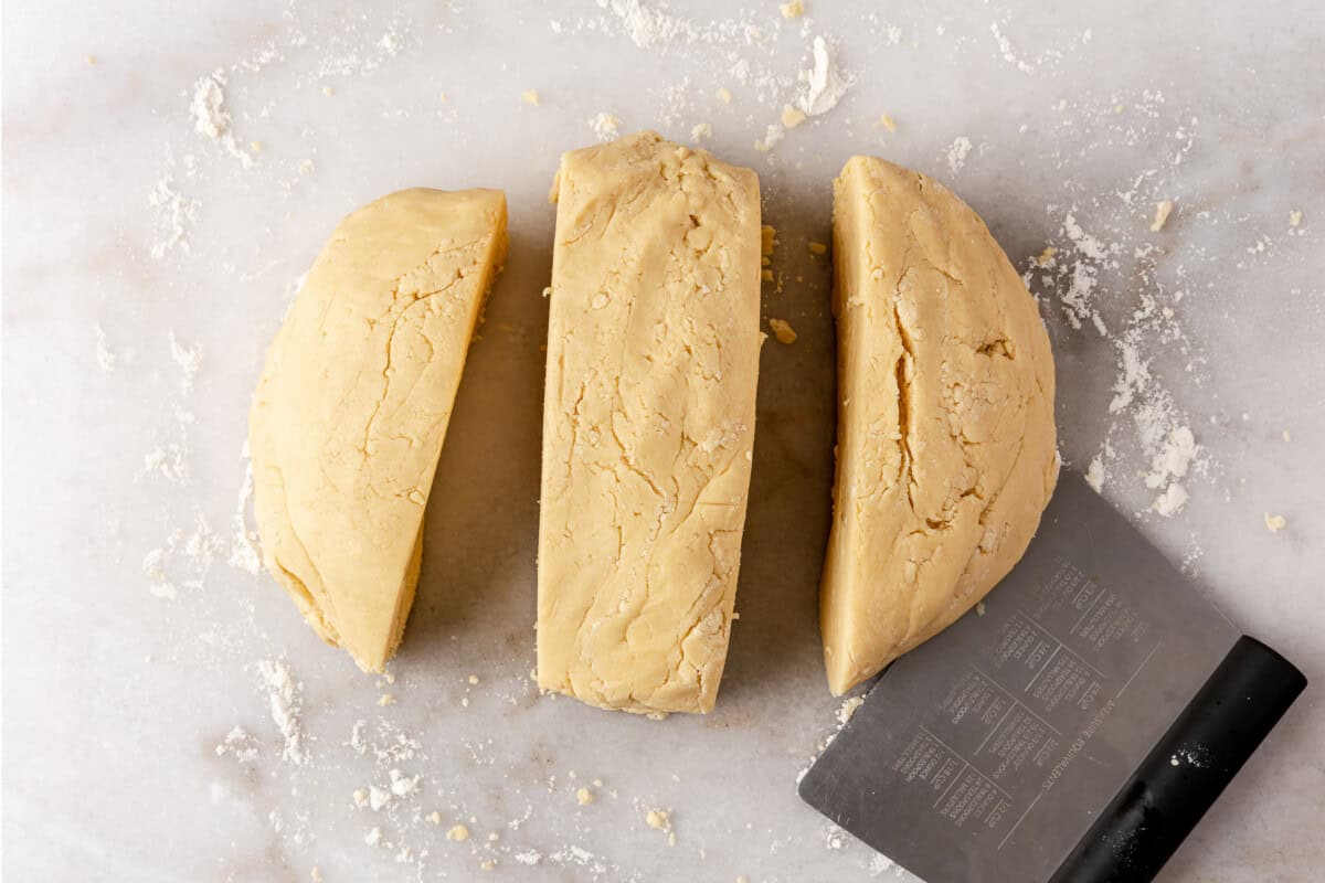 Sugar cookie dough divided into 3 portions. 