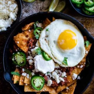 Chilaquiles Rojos. A traditional Mexican breakfast dish with a few Tex Mex additions. This dish is bursting with flavor and spice!