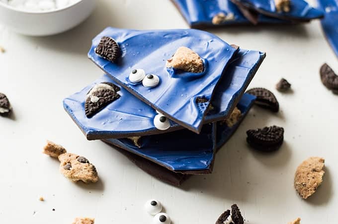 A super fun treat for all ages! Cookie Monster Bark! This easy to make bark is loaded with chunks of cookies and fun little candy eyes.