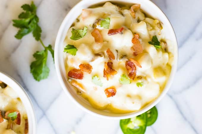 Jalapeño Bacon Hominy is ULTIMATE comfort food. This easy to make super creamy white cheddar hominy is loaded with bacon and jalapeño for extra flavor and heat. Perfect side dish!