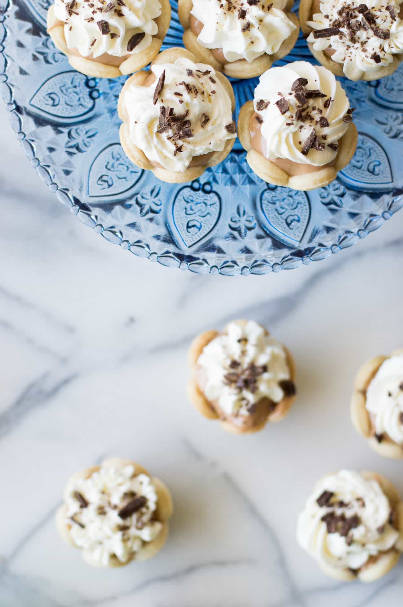 Mini French Silk Pies. Easy to make than you probably think and decadently DELICIOUS! Silky, creamy, chocolate bliss topped with homemade whipped cream. All in bite size mini pies!