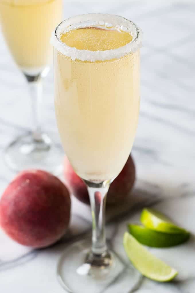 The perfect brunch cocktail! A mixture of a bellini and margarita! Made with peach juice, tequila, and champagne! 