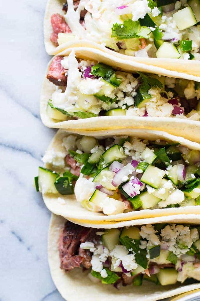 Spicy Habanero Grilled Lamb liven up these tacos, that are a perfect blend of Mexican and Mediterranean flavors! Cool and creamy mojito cole slaw, cucumber salsa, and queso fresco complete the dish! Perfect recipe for grilling season!