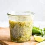 Jar filled with homemade salsa verde.