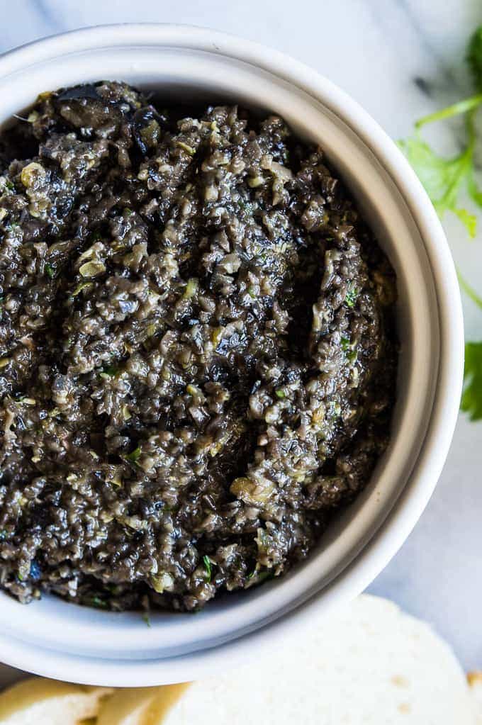 Spicy Black Olive Tapenade is the perfect appetizer made with pureed black olives, cilantro, lime juice, and jalapeños for a little bit of heat! 