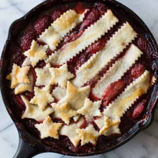 This strawberry cobbler is juicy and sweet! Plus it's topped with a patriotic display of pie crust. Perfect for celebrating the 4th of July!