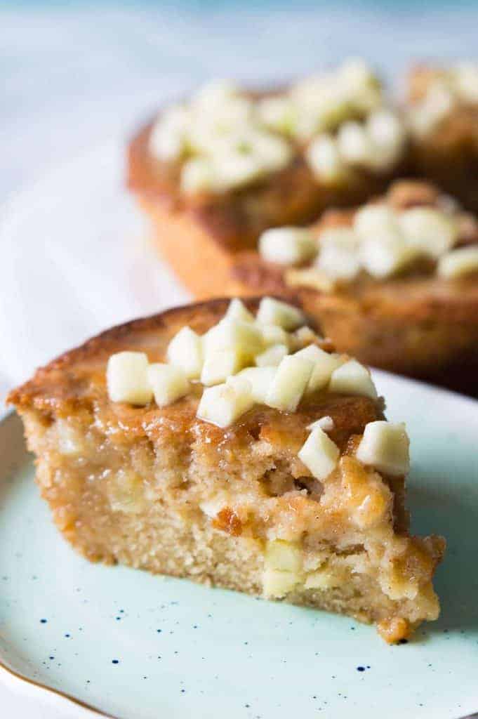 Caramel Apple Skillet cake is bursting with chunks of apple, drizzled with a homemade caramel glaze, and is perfect for Fall baking! 