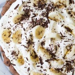 Chocolate Banana Cream Pie. Chocolate pie crust loaded up with layers of chocolate cream, bananas, and vanilla cream. All topped with a thick layer of whipped cream!