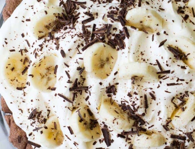 Chocolate Banana Cream Pie. Chocolate pie crust loaded up with layers of chocolate cream, bananas, and vanilla cream. All topped with a thick layer of whipped cream!