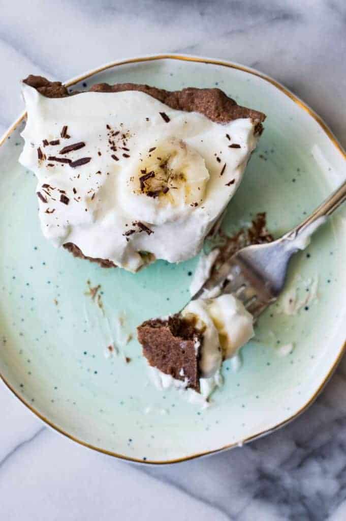 Chocolate Banana Cream Pie. Chocolate pie crust loaded up with layers of chocolate cream, bananas, and vanilla cream. All topped with a thick layer of whipped cream! 