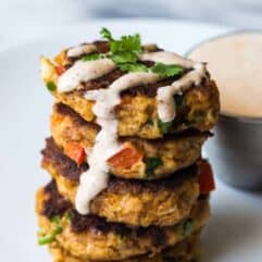 Tex Mex Crab Cakes are bursting with flavor and spice. Packed with fresh peppers, cilantro and lime juice, these crab cakes will definitely be the highlight of any meal!