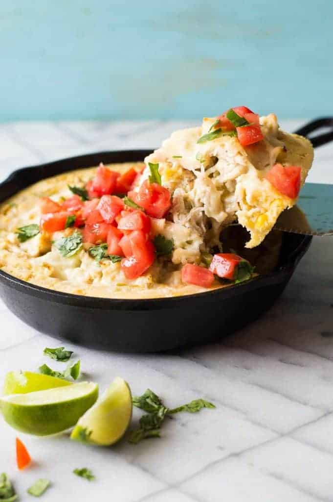 This green chile chicken tamale pie is a quick and easy dinner idea! Flavorful chicken with cheese and green chiles with a cornbread 'crust'. Prepare the chicken ahead of time to make it even quicker! Perfect for a weeknight meal. 