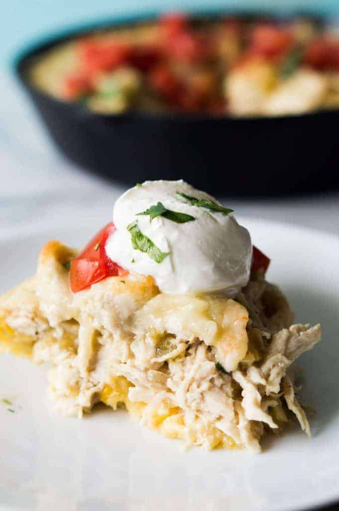 This green chile chicken tamale pie is a quick and easy dinner idea! Flavorful chicken with cheese and green chiles with a cornbread 'crust'. Prepare the chicken ahead of time to make it even quicker! Perfect for a weeknight meal. 