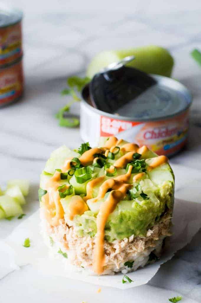 Salmon Stacks!! This super simple recipe is the perfect light and fresh snack, lunch, or light dinner! Sure to impress!!! This dish has layers of fluffy cilantro, lime rice. Salmon mixed with a spicy mayo. Smooth and creamy avocado. And fresh and cool cucumber. Forget getting that pricey sushi! Make this scrumptious snack at home!