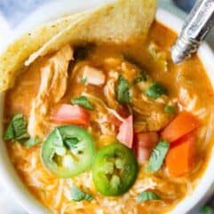Slow Cooker King Ranch Chicken Soup. This EASY soup tastes just like the beloved King Ranch Chicken Casserole. Loaded with cheese, juicy chunks of chicken, and tons of flavor! Simply load up the slow cooker and let this soup simmer during the day so you can enjoy this for dinner!