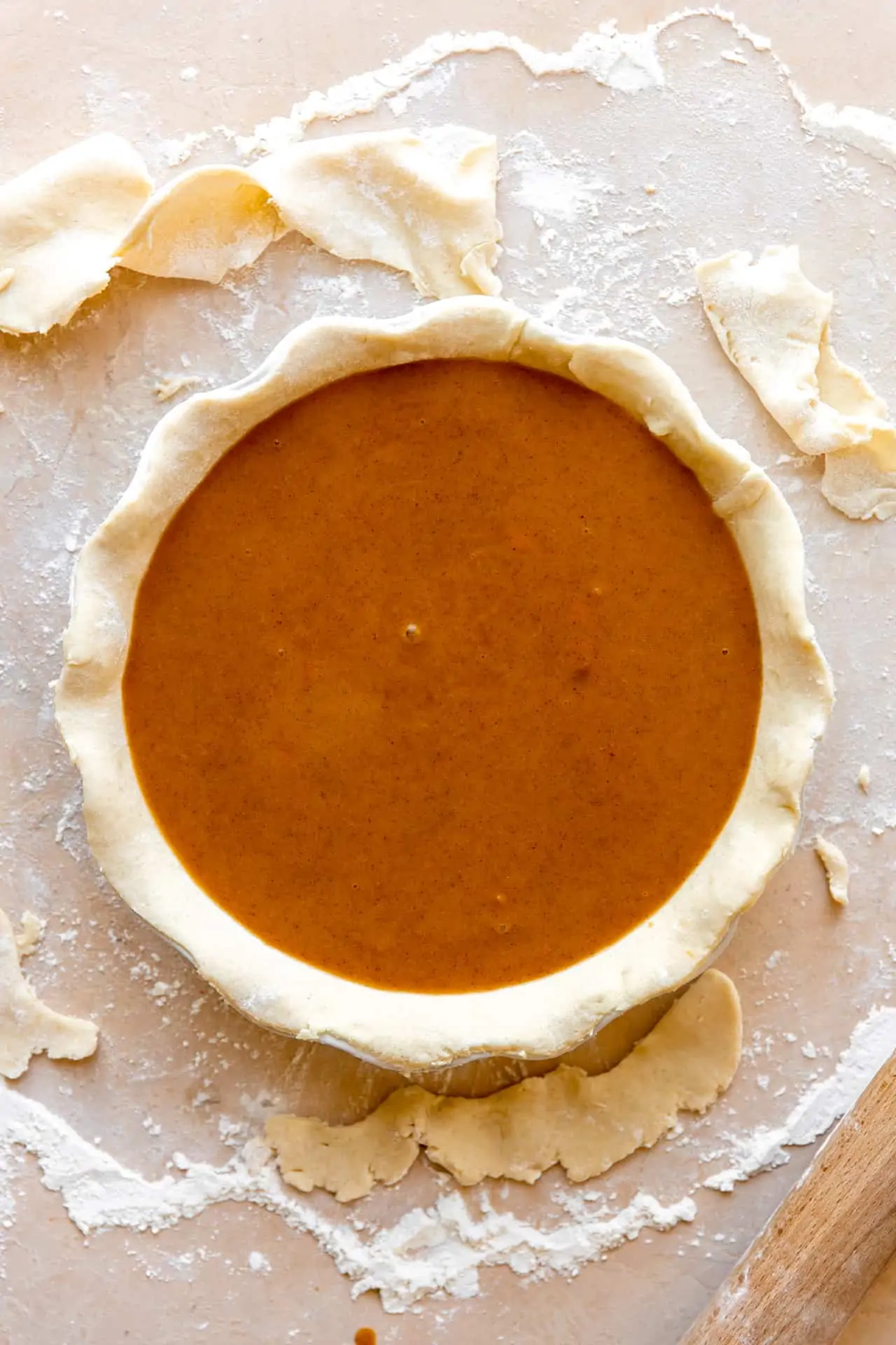 Butternut filling poured into an all butter pie crust, ready to bake.