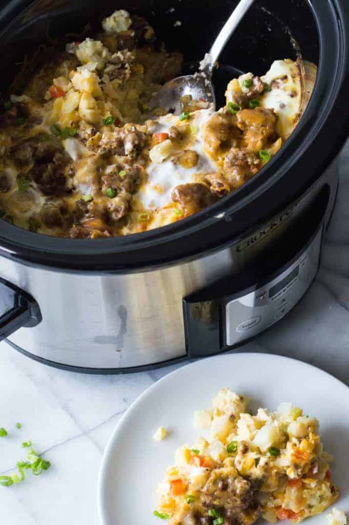 Slow Cooker Breakfast Casserole. This quick and easy to put together breakfast can cook in the slow cooker overnight while you're sleeping!! There's nothing better than waking up to the smell of a homemade breakfast already made. This casserole is loaded up with sausage, diced hash browns, eggs and cheese.