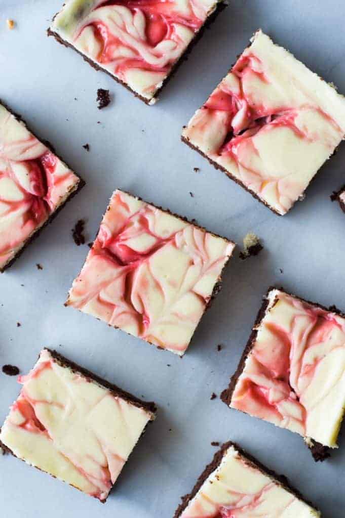 Strawberry Cheesecake Brownies. These homemade brownies are loaded up with a layer of creamy cheesecake then swirled with a sweet strawberry sauce for a pop of color and flavor! Spoon the extra strawberry sauce over the top for an extra special dessert! 