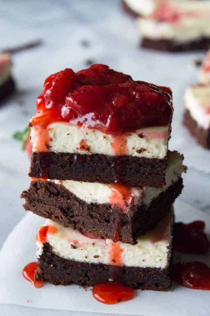 Strawberry Cheesecake Brownies. These homemade brownies are loaded up with a layer of creamy cheesecake then swirled with a sweet strawberry sauce for a pop of color and flavor! Spoon the extra strawberry sauce over the top for an extra special dessert! 