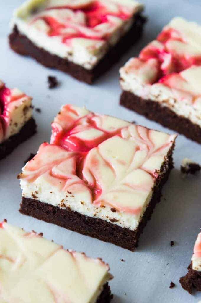 Strawberry Cheesecake Brownies. These homemade brownies are loaded up with a layer of creamy cheesecake then swirled with a sweet strawberry sauce for a pop of color and flavor! Spoon the extra strawberry sauce over the top for an extra special dessert! 