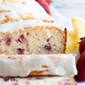 Sliced strawberry lemon pound cake with a lemon glaze.
