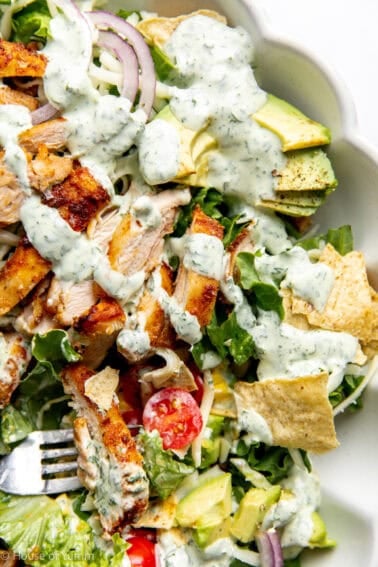 Up close view of dressed chicken taco salad.