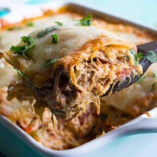 Pulled Pork King Ranch Casserole. The classic casserole famous in Texas gets a little bit of a makeover using tender juicy pulled pork! Layers of crisp tortillas, a chili powder spiked cream sauce with smokey tender pork, and melted cheese. This dish is perfect for get togethers or potlucks!