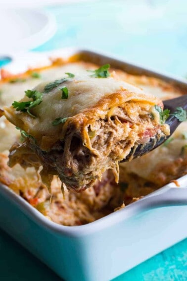 Pulled Pork King Ranch Casserole. The classic casserole famous in Texas gets a little bit of a makeover using tender juicy pulled pork! Layers of crisp tortillas, a chili powder spiked cream sauce with smokey tender pork, and melted cheese. This dish is perfect for get togethers or potlucks!