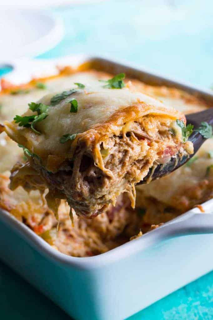 Pulled Pork King Ranch Casserole. The classic casserole famous in Texas gets a little bit of a makeover using tender juicy pulled pork! Layers of crisp tortillas, a chili powder spiked cream sauce with smokey tender pork, and melted cheese. This dish is perfect for get togethers or potlucks! 