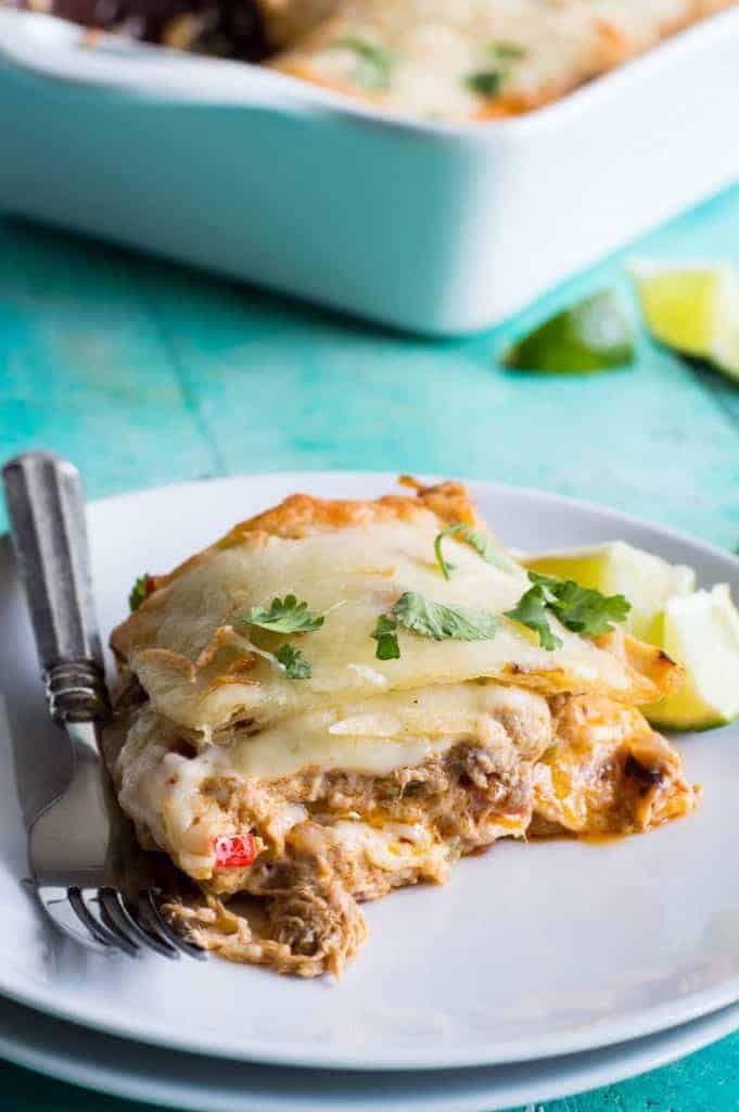 Pulled Pork King Ranch Casserole. The classic casserole famous in Texas gets a little bit of a makeover using tender juicy pulled pork! Layers of crisp tortillas, a chili powder spiked cream sauce with smokey tender pork, and melted cheese. This dish is perfect for get togethers or potlucks!