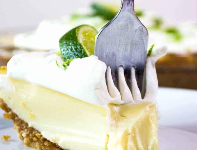 Tequila Lime Pie! An ultra creamy, lime pie laced with a hint of tequila! Almost like enjoying a bite of margarita!